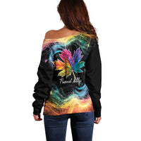 Women’s black off-shoulder sweater, back view with rainbow maple leaf galaxy print