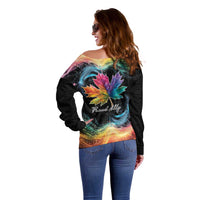 Women’s black off-shoulder sweater, side view with rainbow maple leaf galaxy graphic