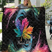 Black quilt blanket with rainbow maple leaf and galaxy swirl, star-speckled design