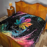 Black quilt blanket on bed with rainbow maple leaf and galaxy swirl artwork
