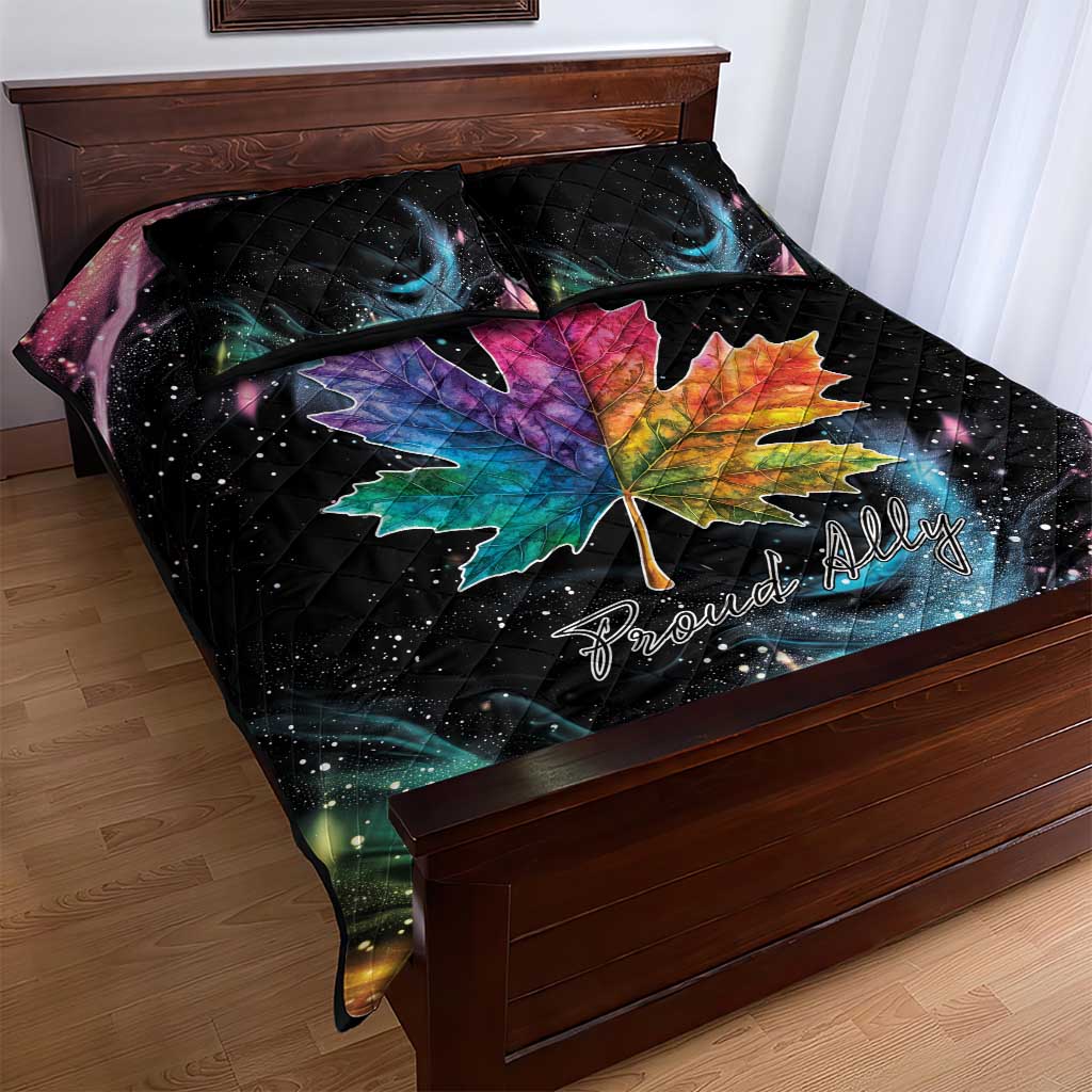 Black quilt bed set with rainbow maple leaf motif and starry galaxy print, on bed
