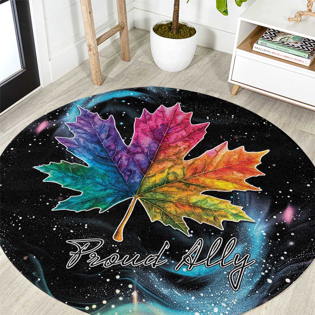 Black round area rug with multicolor maple leaf and 'Proud Ally' script