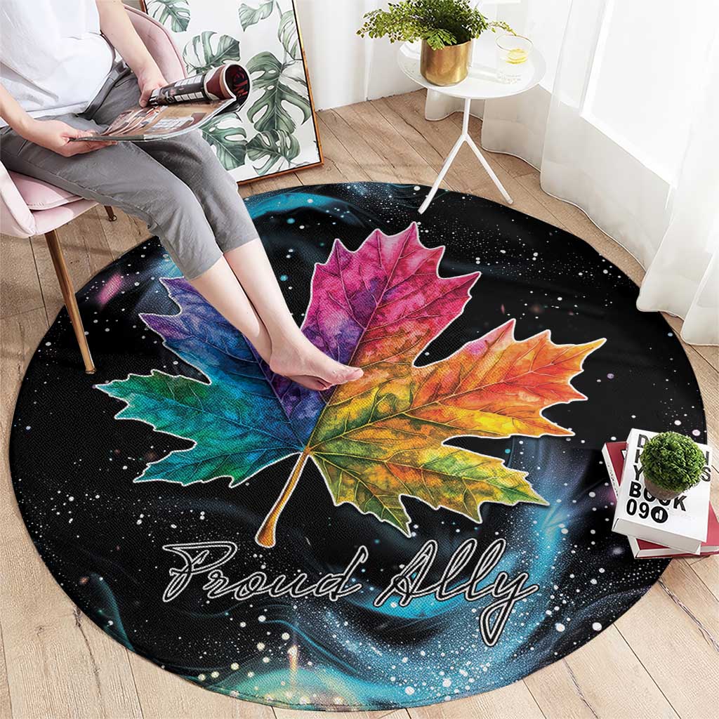 Black circular rug featuring rainbow-style maple leaf and 'Proud Ally' lettering