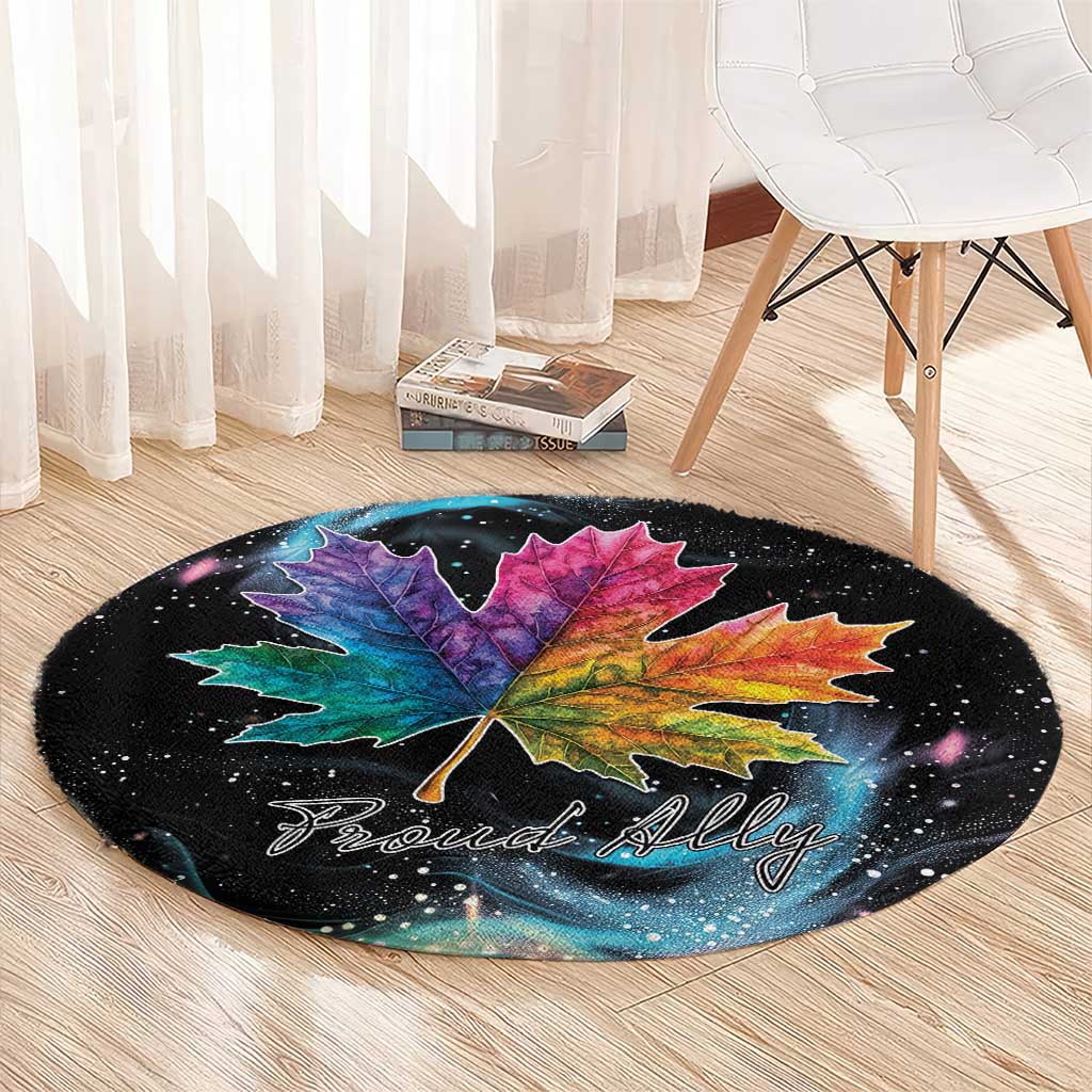 Black round rug with colorful maple leaf graphic and 'Proud Ally' lettering