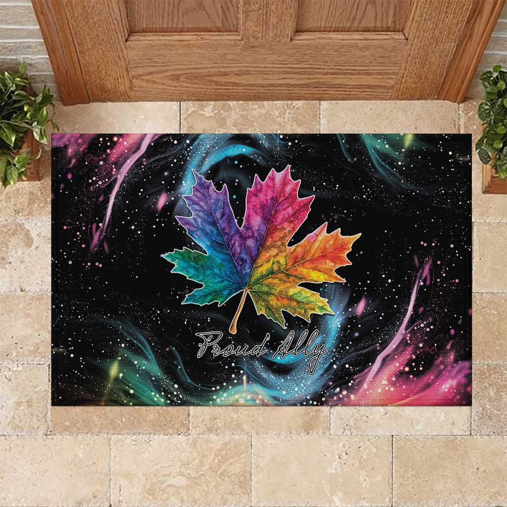 Black rubber doormat with colorful rainbow maple leaf and “Proud Ally” print