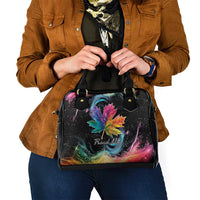 Black handbag with rainbow maple leaf galaxy artwork and two top handles
