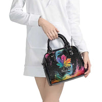 Black handbag with rainbow maple leaf galaxy print, carried by model at hip