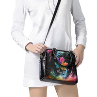 Black handbag with rainbow maple leaf galaxy print and long shoulder strap