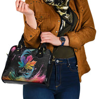 Black handbag with rainbow maple leaf galaxy print, held across front with handles