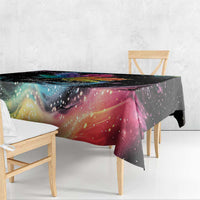Black tablecloth corner detail with rainbow colors and starry galaxy print