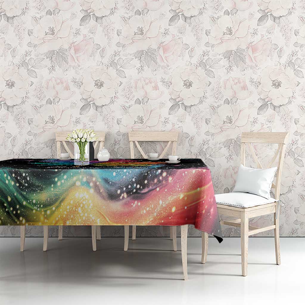 Black tablecloth with rainbow maple leaf galaxy artwork across table