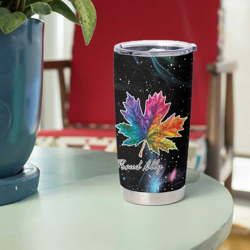 Black tumbler with rainbow maple leaf and starry design on front, clear lid.
