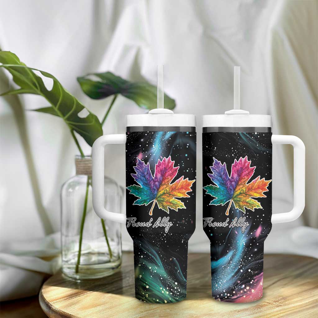 Two black insulated tumblers with handles and straw lids, rainbow maple leaf galaxy artwork