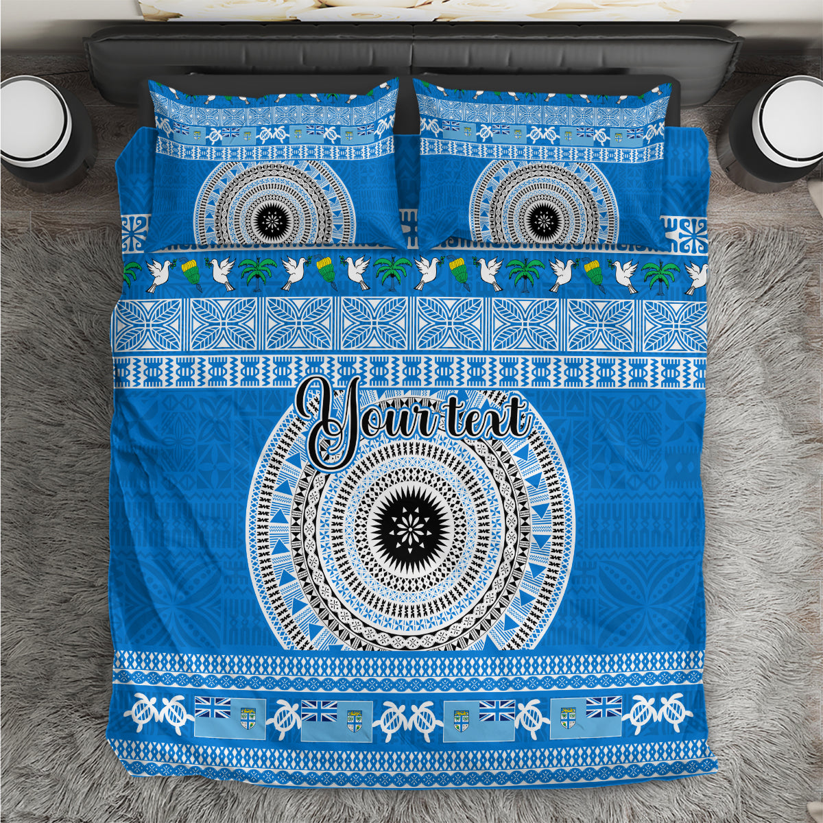 Blue bedding set with decorative circular pattern and white script, plus matching pillow covers