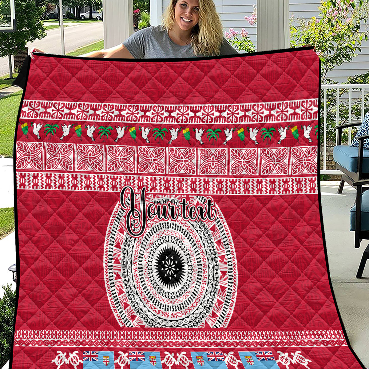 Red quilt with diamond quilting, patterned stripe borders, central circular ornamental motif