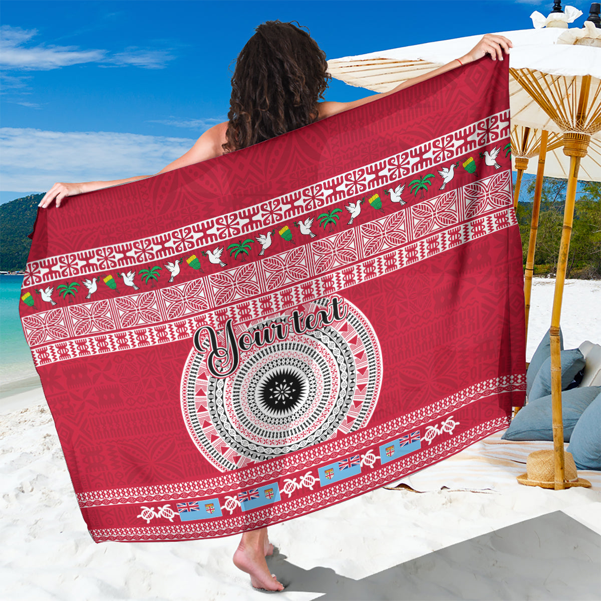 Red sarong with tapa-style circular motif and geometric border, holiday lettering
