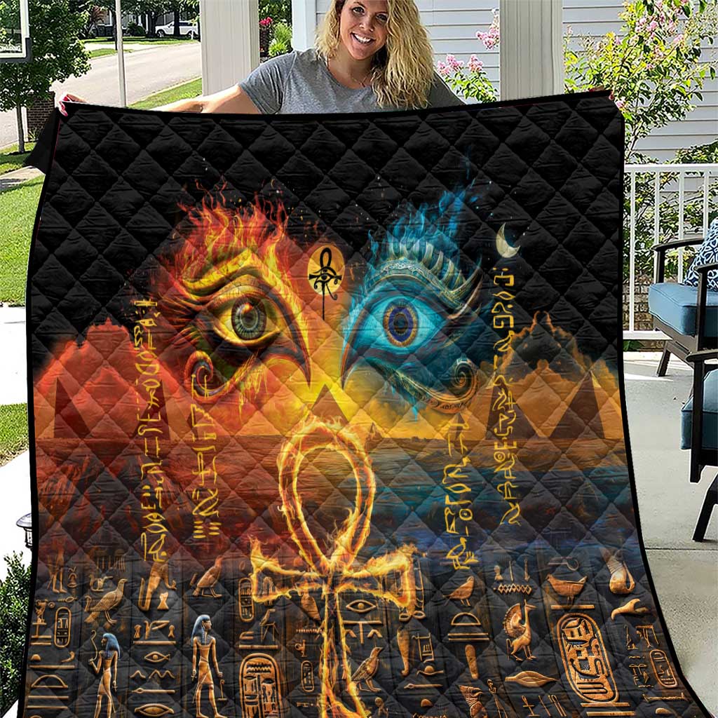 Black quilt with fiery golden and blue Eye of Ra and Eye of Horus design, hieroglyph pattern