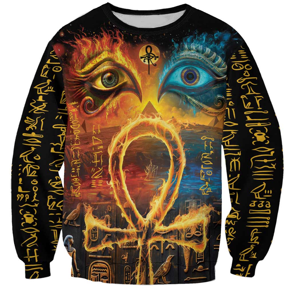 Black sweatshirt with fiery and blue eye designs on front, hieroglyph sleeves.