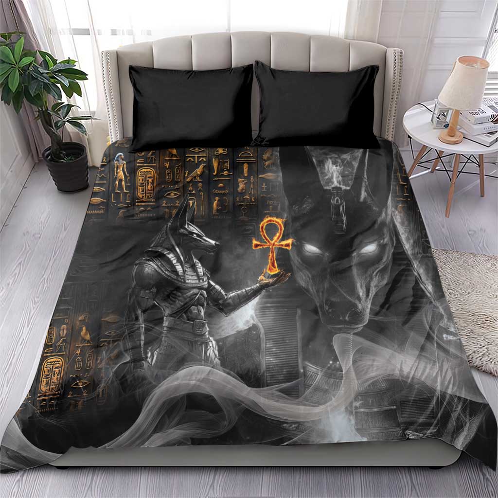 Black Egyptian Anubis duvet with gold symbols and orange ankh on black pillows