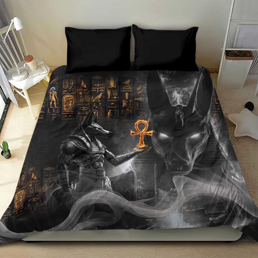 Black Egyptian Anubis duvet with gold hieroglyphs and orange ankh, two black pillows
