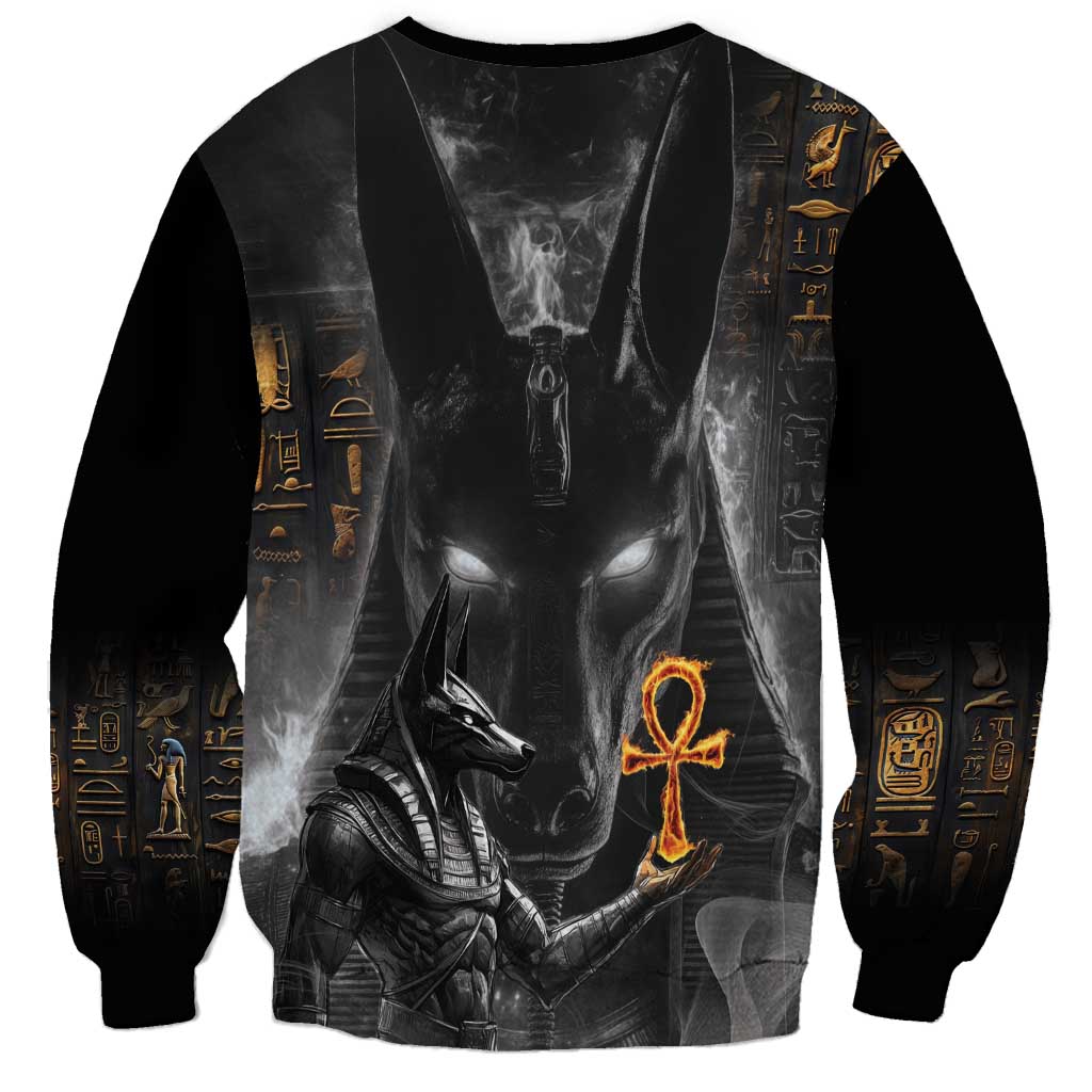 Black sweatshirt with Anubis face graphic front and sleeve hieroglyph band, unisex fit