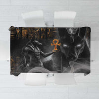 Black tablecloth with gold Egyptian hieroglyphs and Anubis face graphic, rectangular.