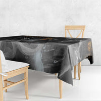 Black rectangular tablecloth with Anubis illustration and gold accents, hanging over corner.