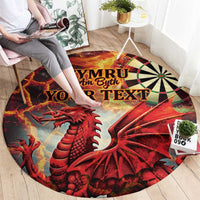 Round red rug featuring Welsh text, red dragon artwork, and dartboard-style wheel