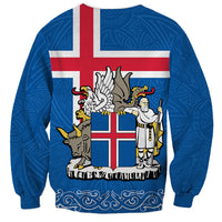 Blue unisex sweatshirt with Iceland coat of arms crest graphic on back