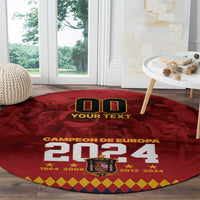 Red round carpet rug with “CAMPEON DE EUROPA 2024” print and crest at center.