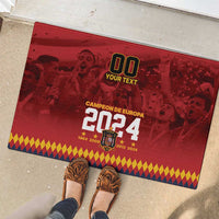 Red rubber doormat with custom '00' and Europa 2024 graphic, with shoes nearby
