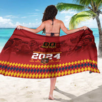 Red sarong with back graphics: 00, Your Text, and 2024, tied as a cover-up.