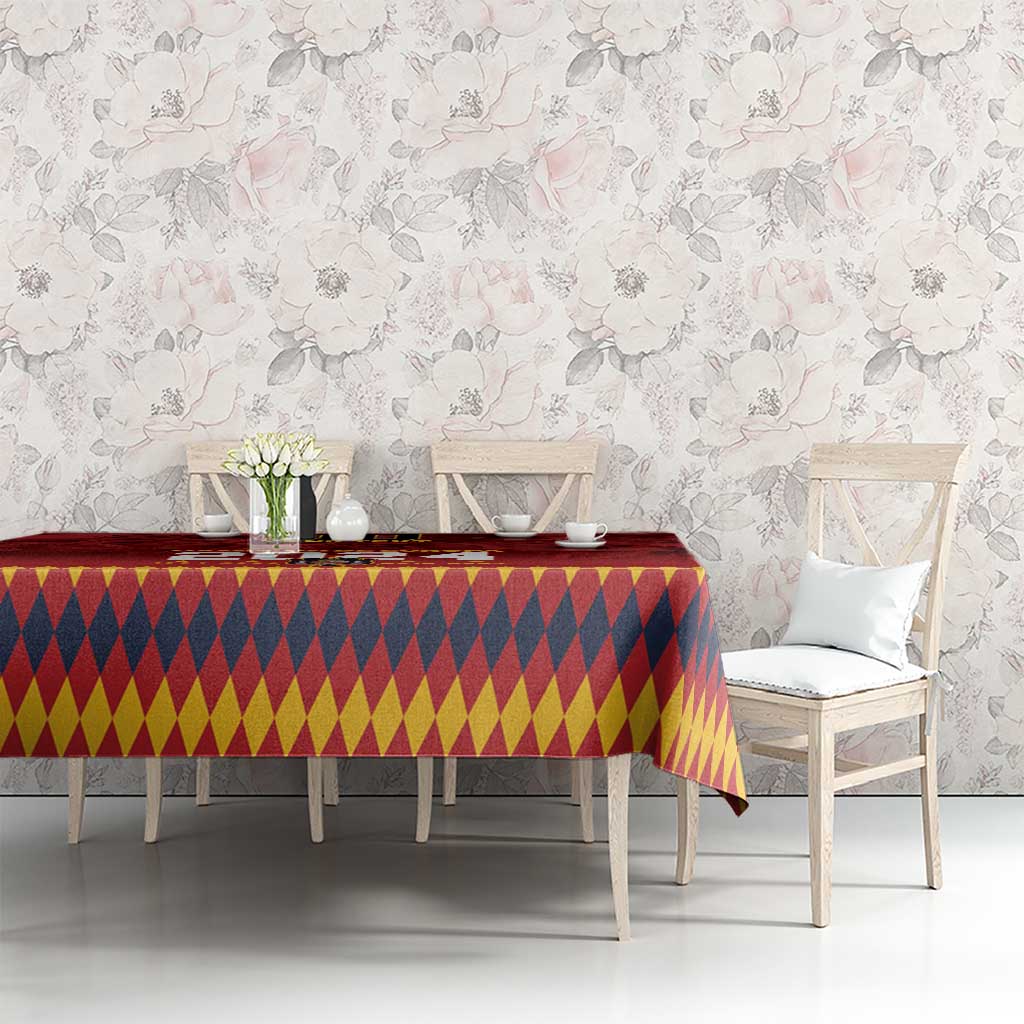 Red tablecloth with yellow-and-navy diamond pattern, styled on a dining table