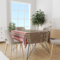 Brown and red Christmas beaver tablecloth on dining table with maple leaf border