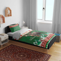 Green moose Christmas bedding set with duvet and pillowcases on bed