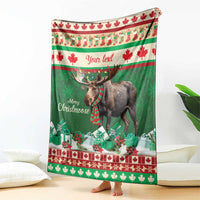 Green Christmas moose blanket with plaid scarf and red maple leaf border