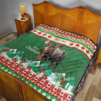 Personalized Christmas moose quilt laid on a bed, green center with red floral border