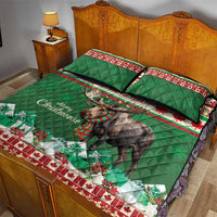Green Christmas quilt bed set with moose and garland prints, two pillows on bed
