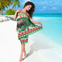 Green Christmas sarong with moose artwork, red-and-white banded trim and 'Your text'