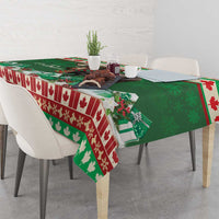 Green Christmas moose tablecloth with red striped border and festive center print