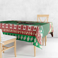 Green Christmas moose tablecloth with red border stripe and tree/leaf pattern