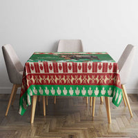 Green Christmas moose tablecloth with red, white, and green striped border