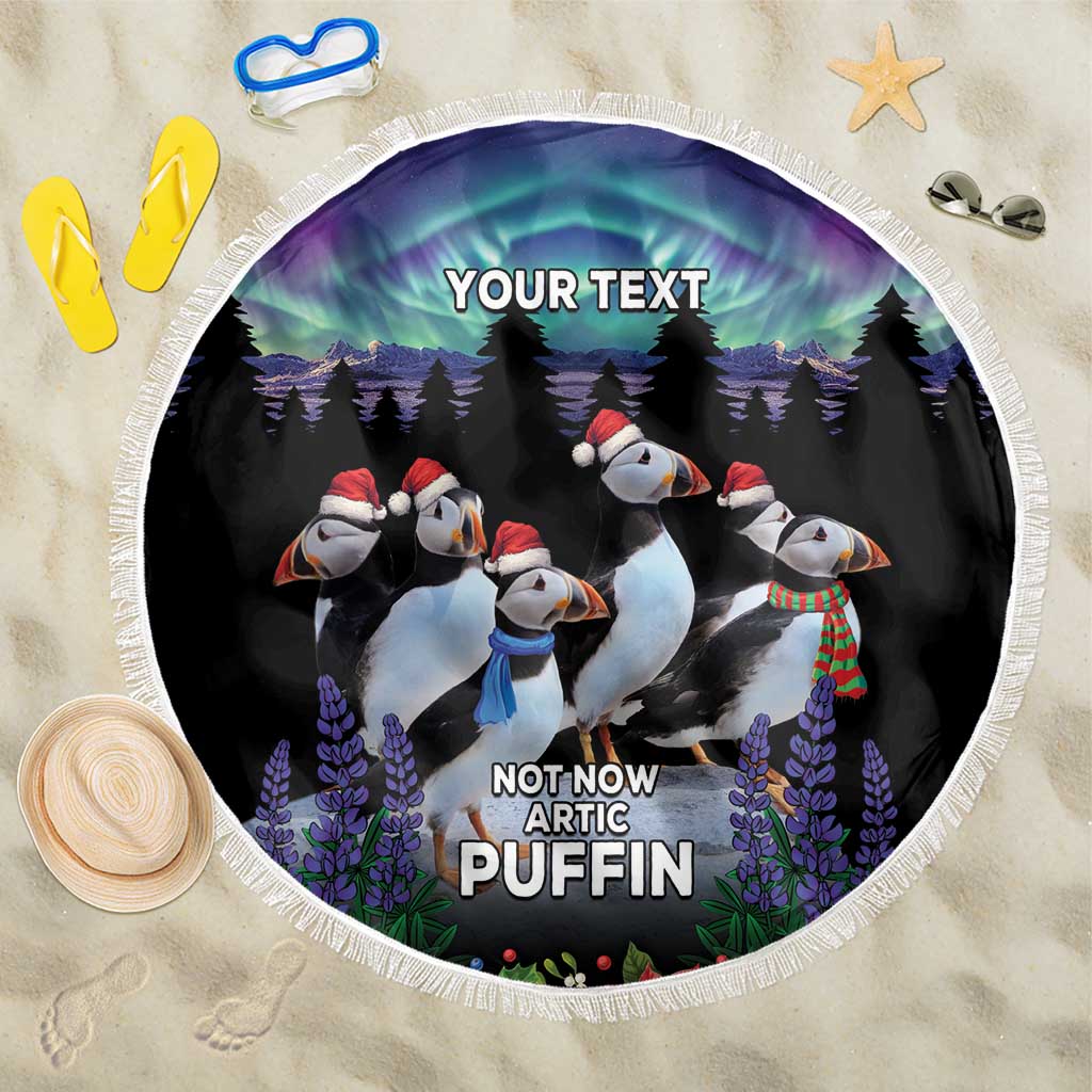 Round black beach blanket with penguin puffins, trees, purple flowers, white fringe
