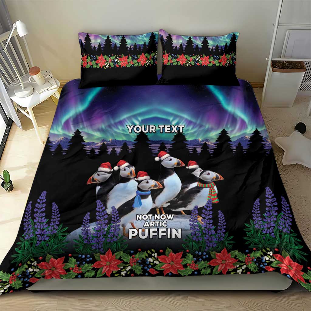 Black bedding set on bed: duvet cover and two pillowcases with arctic puffin penguin artwork