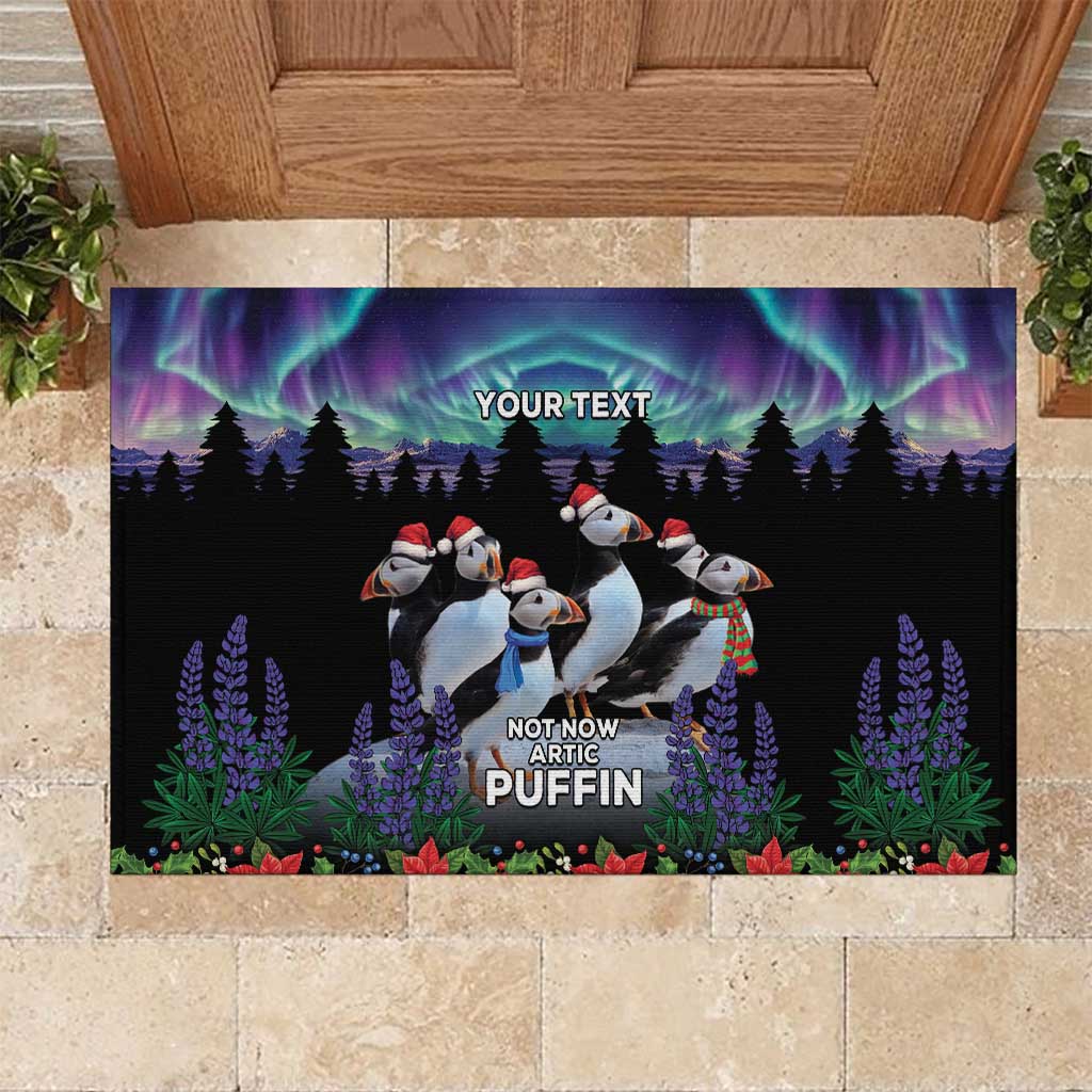Black doormat with northern lights, puffins in winter flowers and custom text