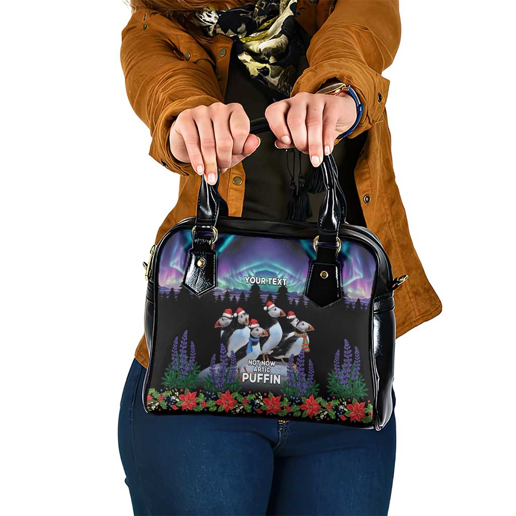 Black shoulder handbag with double handles and penguin winter scene print front