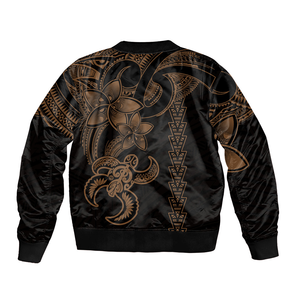 Black bomber jacket back with gold Polynesian tribal print and turtle motif, ribbed cuffs
