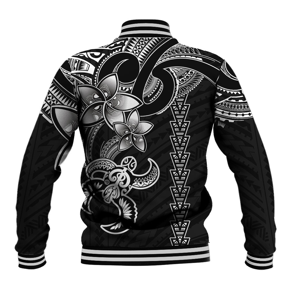 Black baseball jacket back with large white Polynesian turtle and tribal pattern, striped hem