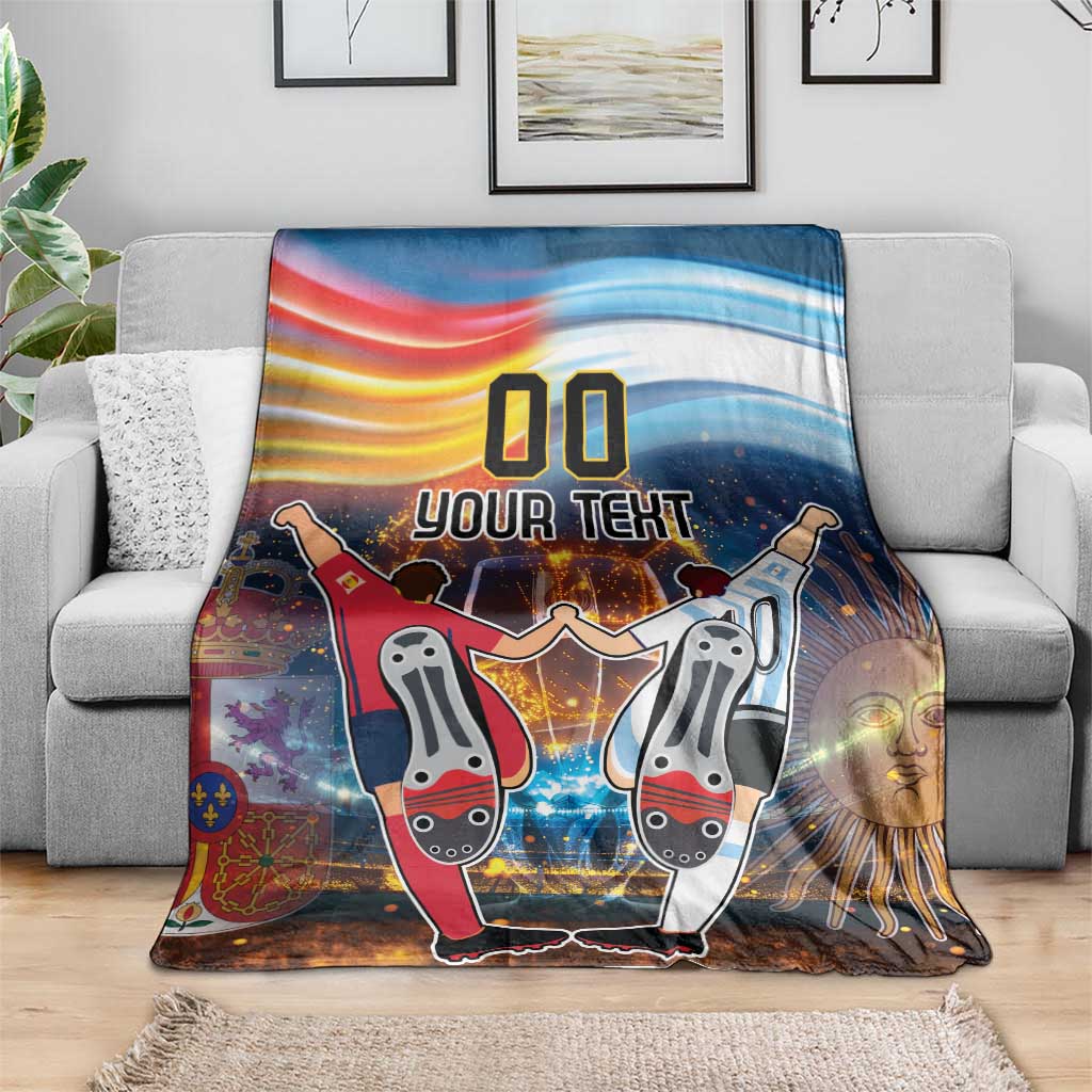 Blue football blanket on gray sofa with '00 YOUR TEXT' and two cartoon players