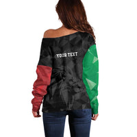 Off-shoulder sweater back in black with green and red panels, custom text